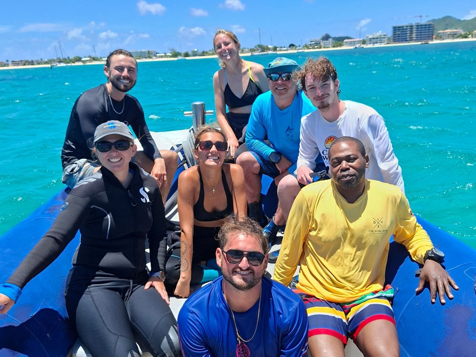 Group of divers on the dive boat after a dive in St. Maarten